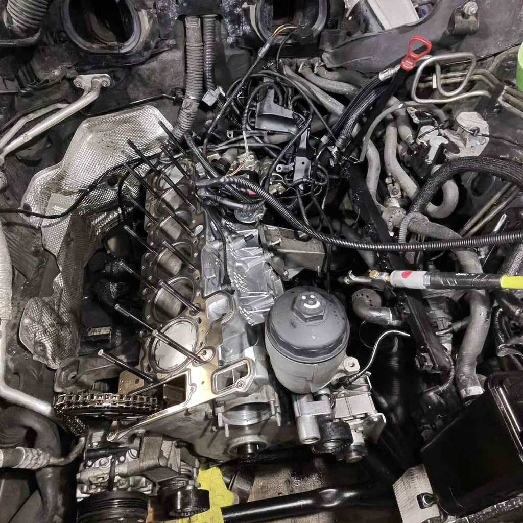 M54 engine in the car with the cylinder head removed, ready for thread inserts