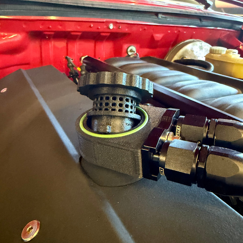 BMW Vented Oil Cap installed on the valve cover, close-up