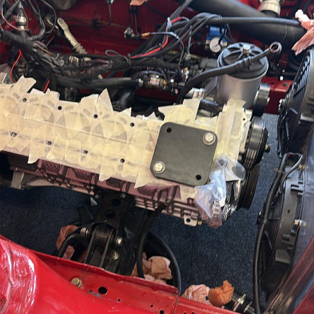 M54 Threaded Insert Kit drill fixture mounted on the block in the engine bay